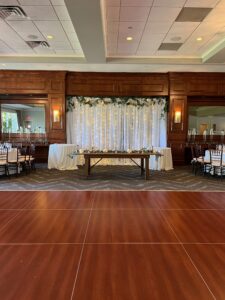 Paramount Country Club wedding ceremony with a stone wall and a mountain backdrop