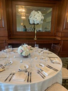 Guest table with low centerpiece for wedding at paramount country club